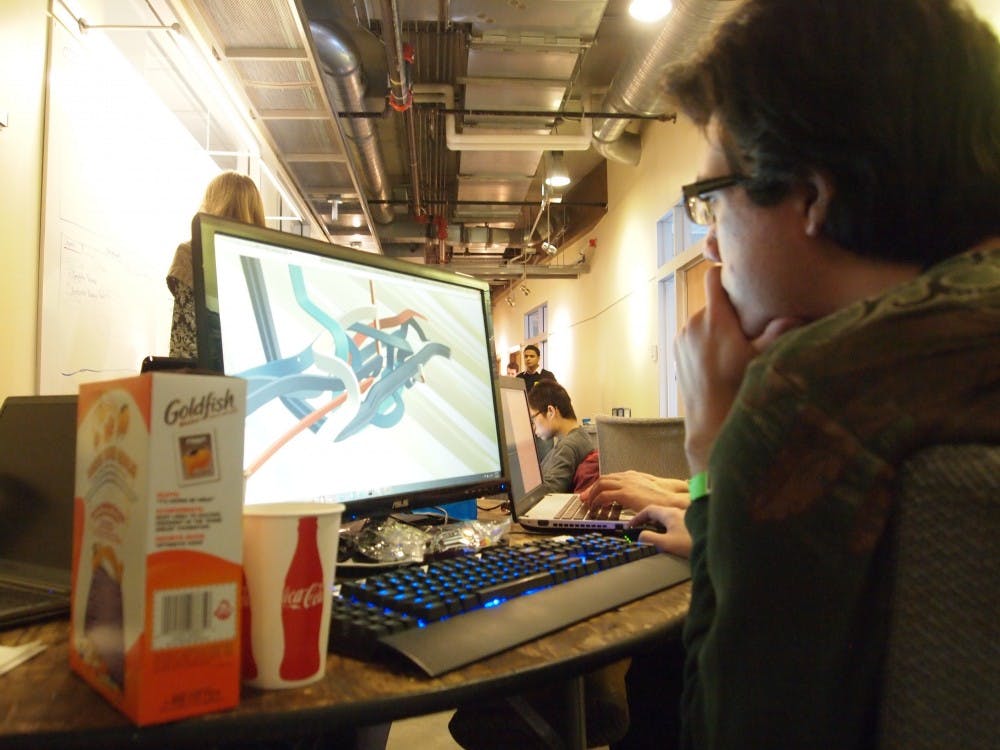 A student programmer develops his application during the competition. 