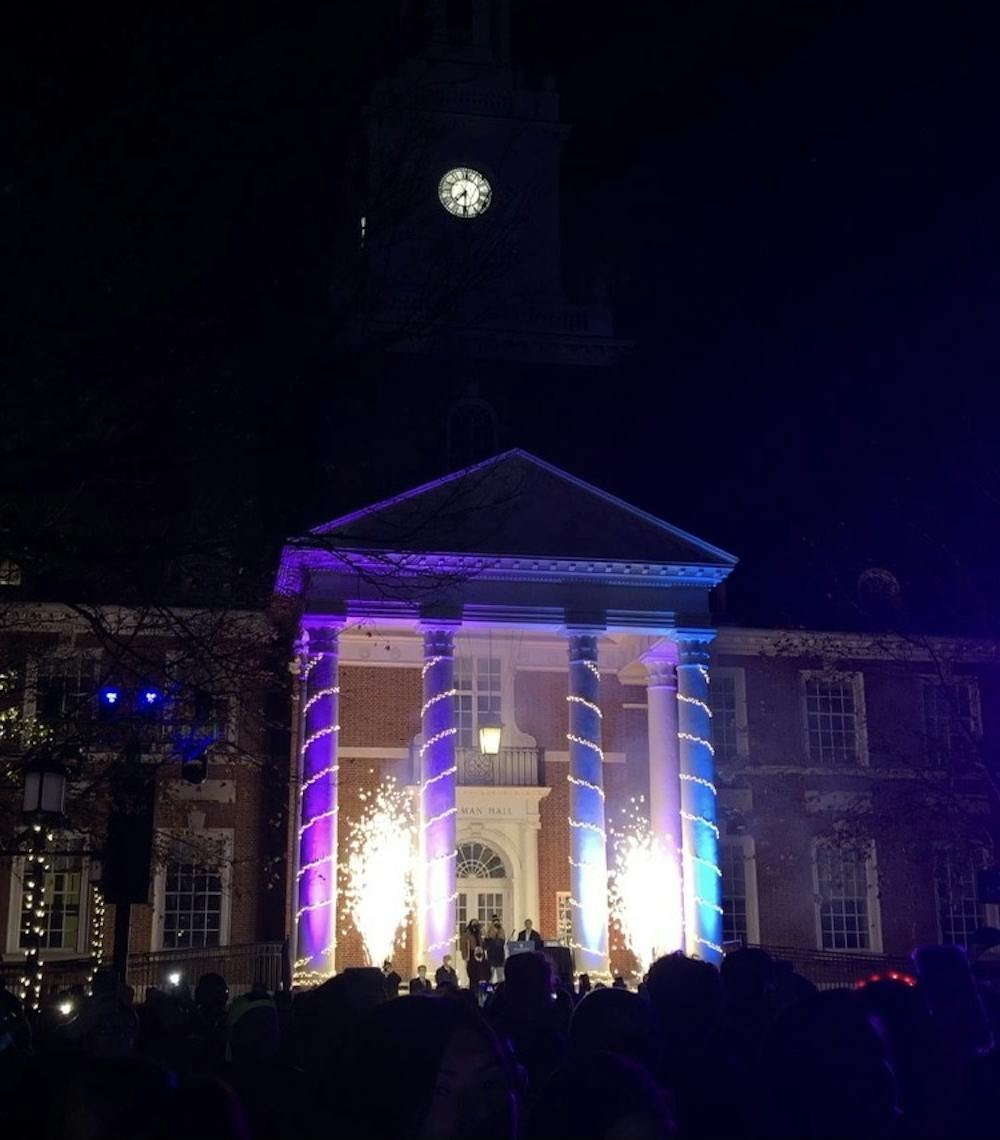 COURTESY OF SOPHIA LIN
Gilman Hall lights up as the Hopkins community celebrates the annual Lighting of the Quads.