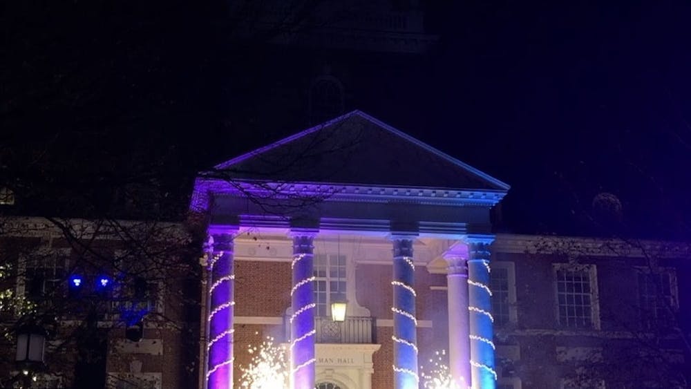 COURTESY OF SOPHIA LIN
Gilman Hall lights up as the Hopkins community celebrates the annual Lighting of the Quads.
