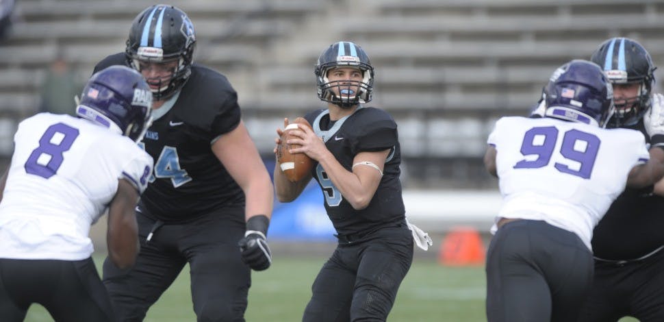 HOPKINSSPORTS.COM
Senior quarterback Jonathan Germano surveys the field for an open receiver to pass to.