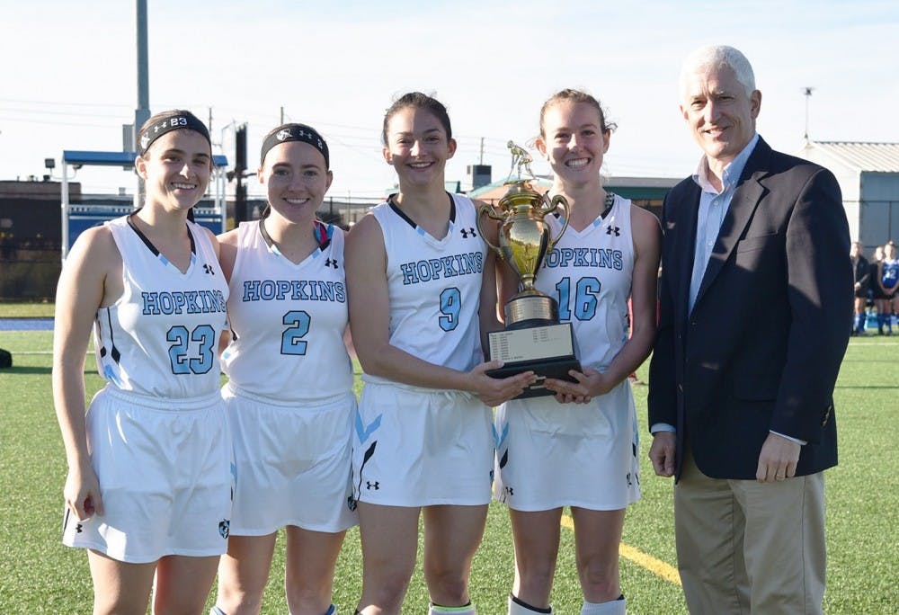 COURTESY OF HOPKINSSPORTS.COM

The seniors on the field hockey team receive the Centennial Conference Tournament trophy after defeating F&M in penalty strokes.
