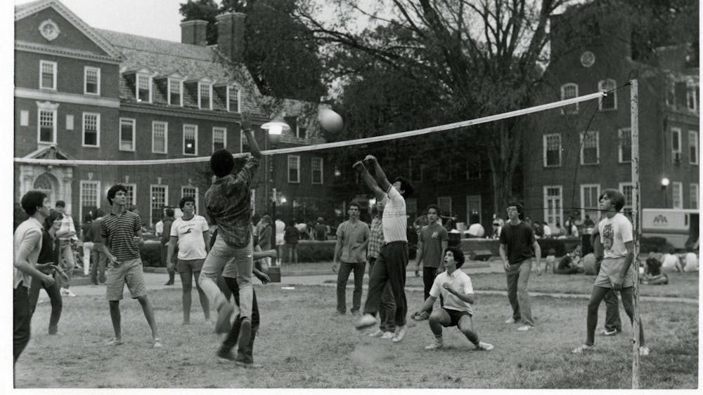 COURTESY OF THE UNIVERSITY ARCHIVES — SHERIDAN LIBRARIES
Students play volleyball on Freshman Quad in 1980, when Kun began his humor column.