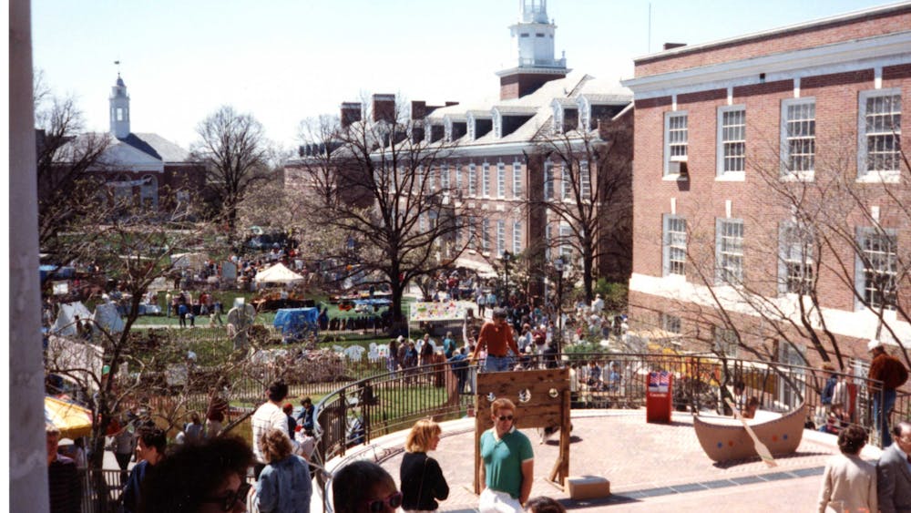 COURTESY OF THE JOHNS HOPKINS UNIVERSITY GRAPHIC AND PICTORIAL COLLECTION
Spring Fair attendees walk around Wyman Quad in 1988, the same year Winfield arrived at Hopkins.