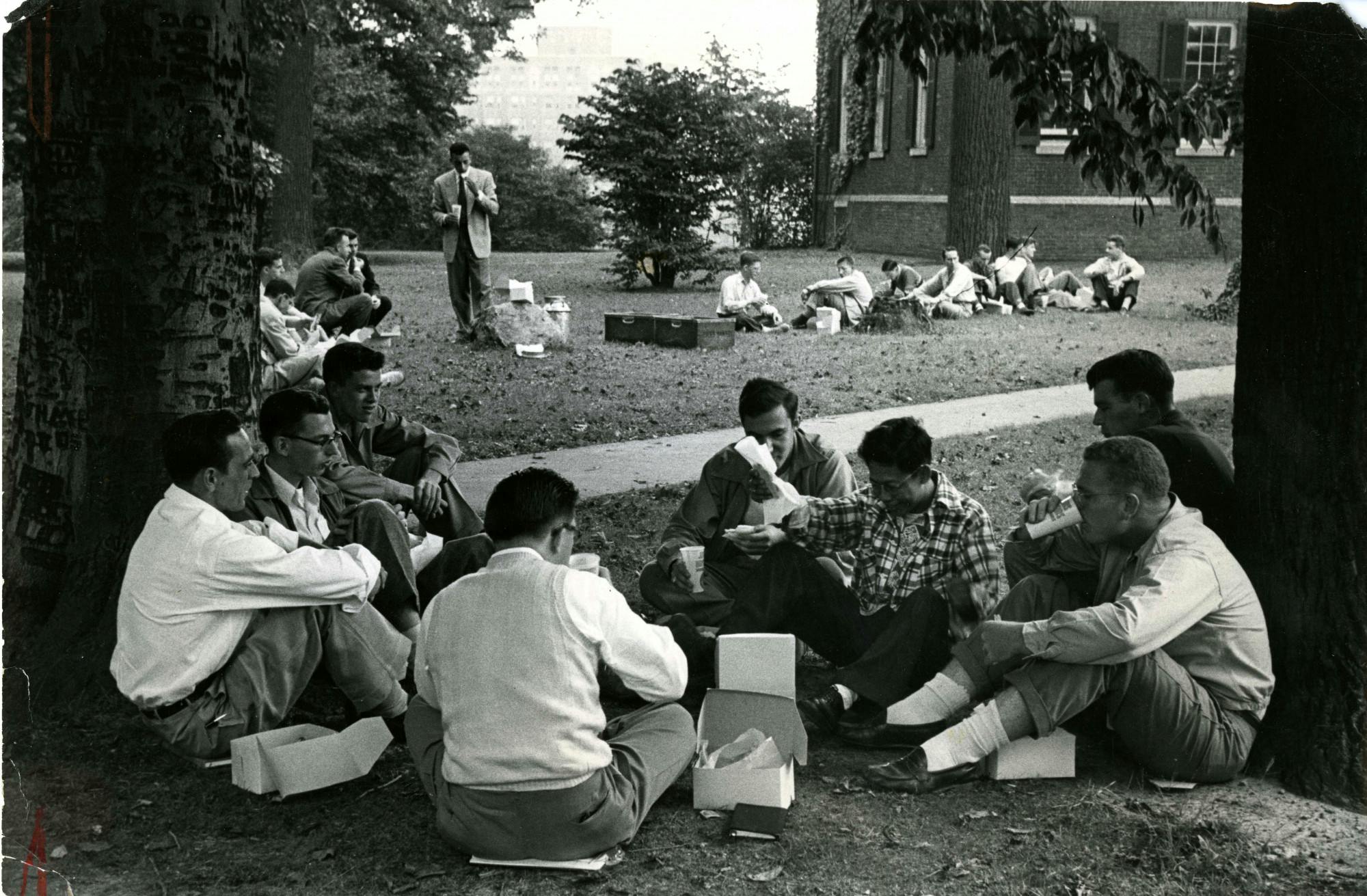 COURTESY OF THE UNIVERSITY ARCHIVES — SHERIDAN LIBRARIES&nbsp;
Students picnic next to Homewood House circa 1950, around when Griffith was Editor-in-Chief.