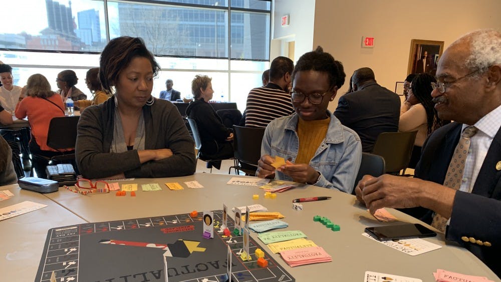 Event attendees played the board game Factuality, where they acted as characters with different identities. 
