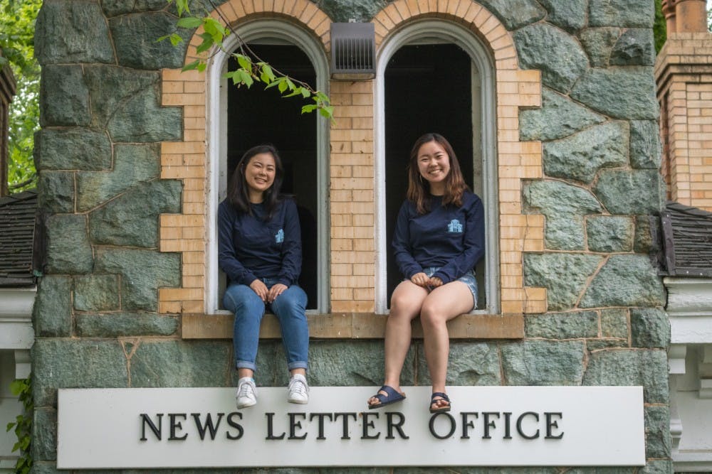 NEHA SANGANA / PHOTOGRAPHY STAFF
Ome and Ko celebrate the time they’ve spent working on The News-Letter