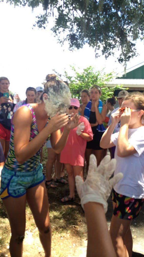COURTESY OF ADDY PERLMAN
Pledges bobbing for apples as part of their quest to become sisters.