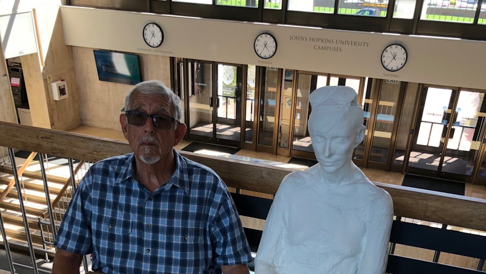 COURTESY OF CALEB DESCHANEL
“Henry James Korn and a plastered friend on a recent visit to the Milton S. Eisenhower Library.”