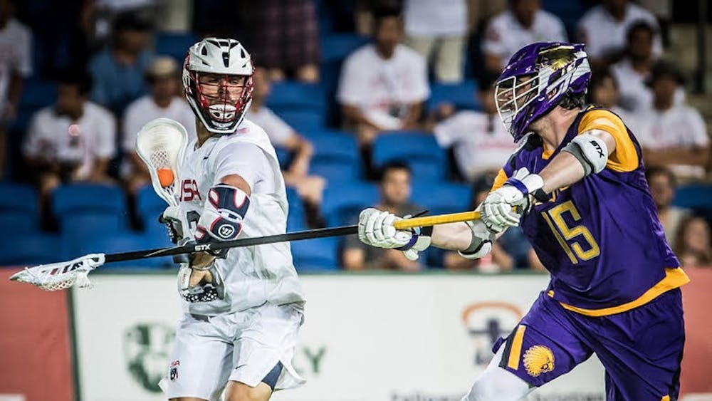COURTESY OF JAKE FOX
Jake Fox (right) playing on the Iroquois Nationals at the 2018 FIL World Championship.