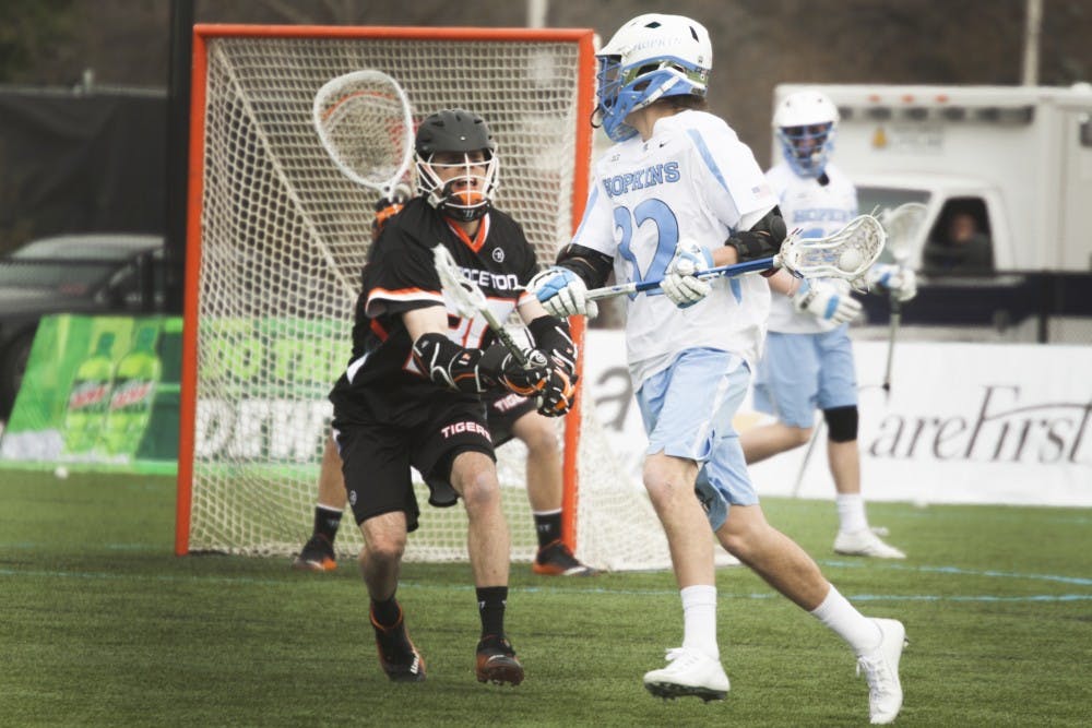 SOFYA FREYMAN/PHOTOGRAPHY STAFF
Sophomore Shack Stanwick helped the Blue Jays to a 17-7 victory on Saturday with two goals and three assists. See Page B12.