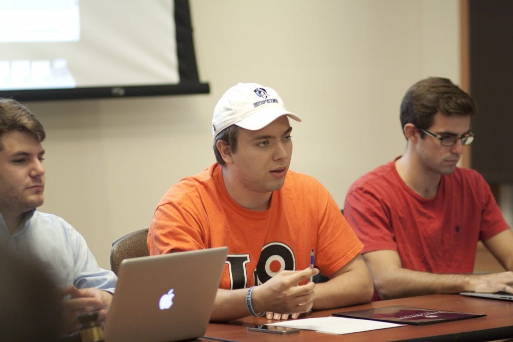  COURTESY OF SOFYA FREYMAN
Plush, center, is resigning as SGA Executive President. He was elected to the position last April.