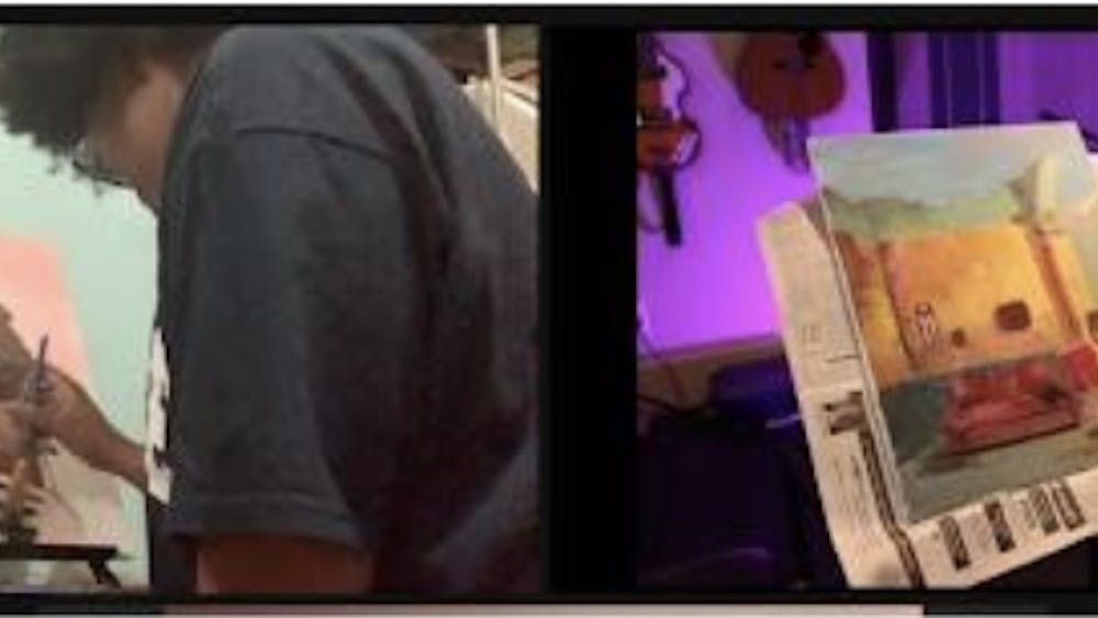 COURTESY OF SARAH JUNG
Artists Shayla-Mona’e Russell and Dylan Aiello paint their interpretations of the poem “La Negra.”