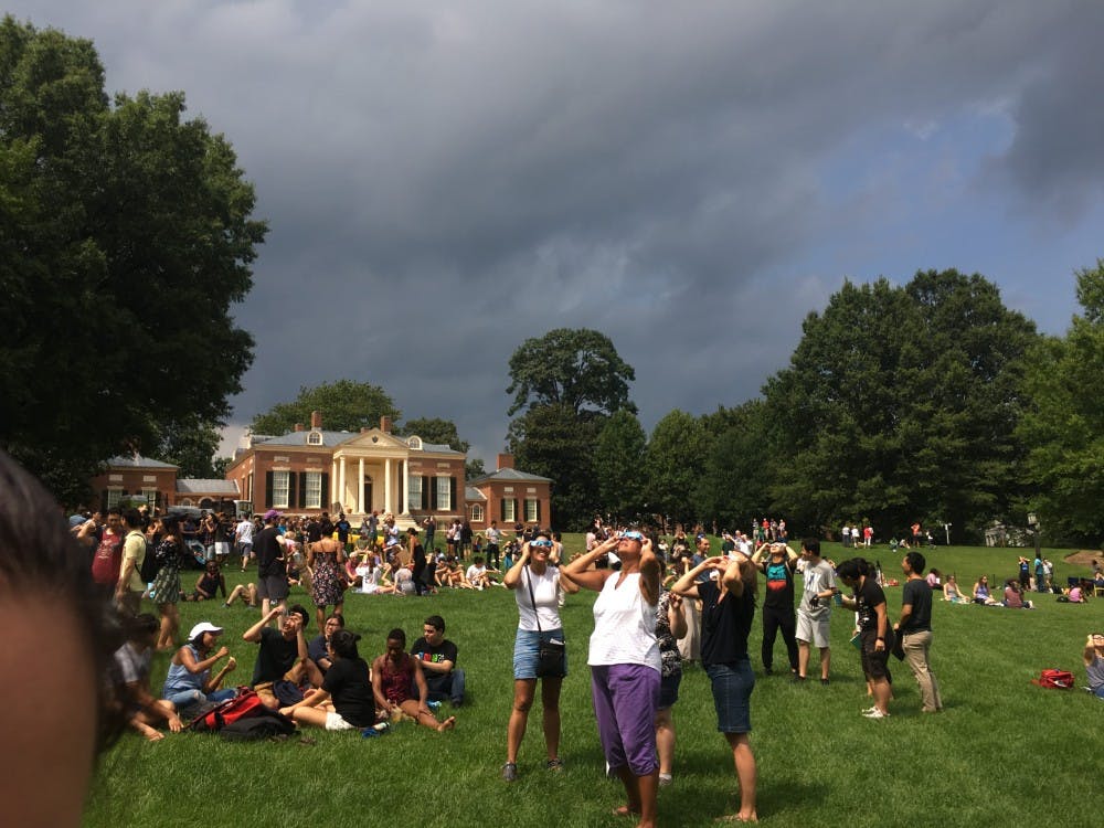 COURTESY OF ROLLIN HU
Students, staff and families gathered on the Beach to watch the Aug. 21 partial solar eclipse.