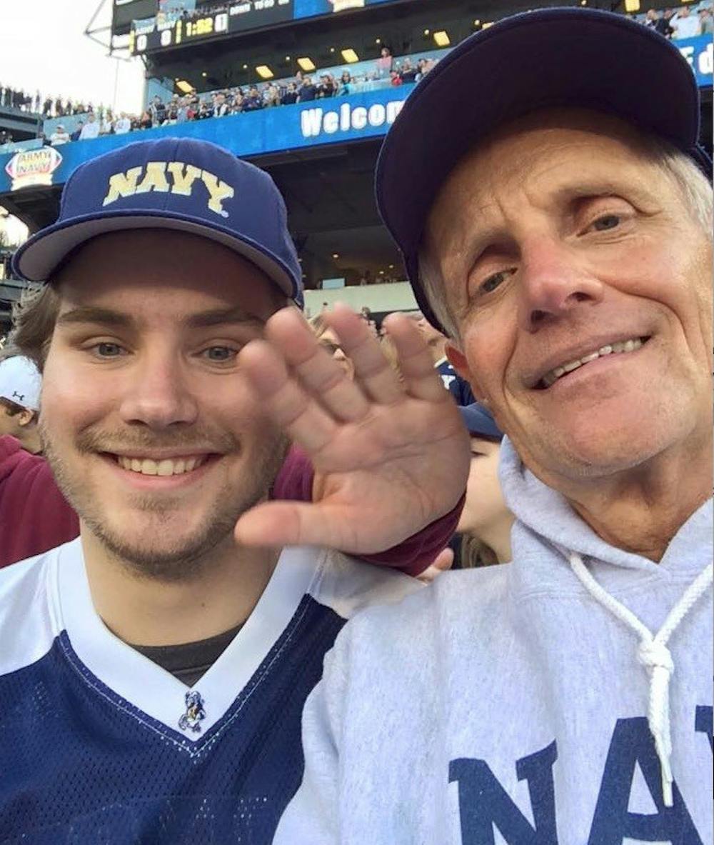 COURTESY OF ANDREW JOHNSON
Johnson and his father at an Army- Navy Game.