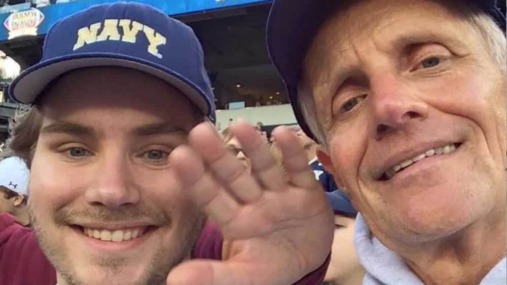 COURTESY OF ANDREW JOHNSON
Johnson and his father at an Army- Navy Game.