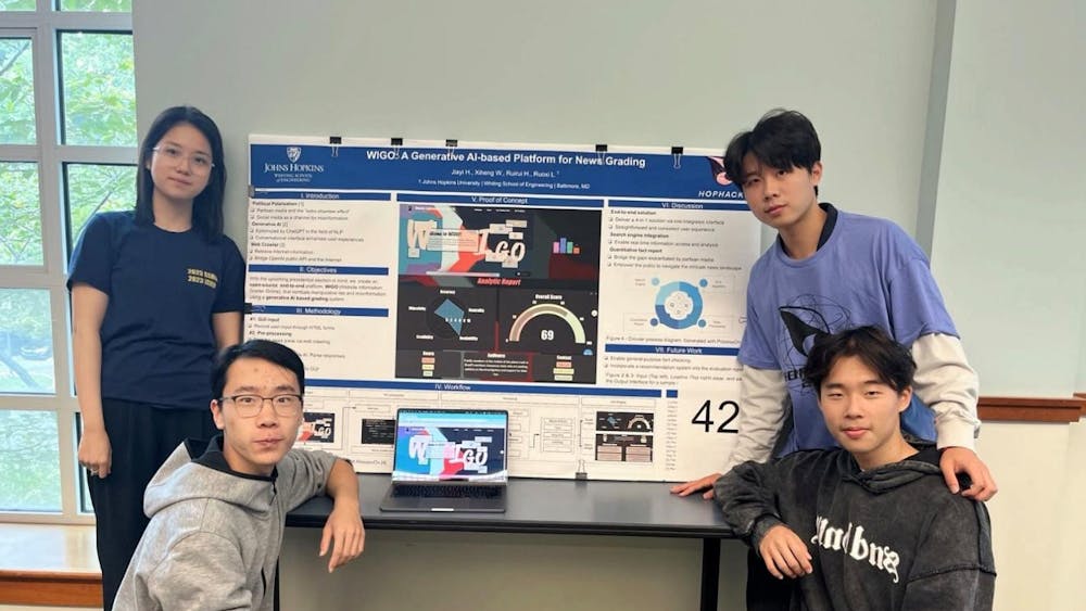COURTESY OF ANNIE HUANG
Huang (top left) shares her experiences as a freshman participating in HopHacks, a 36-hour coding competition, alongside Tom Wang (bottom left), Jonathan He (top right) and Kevin Lie (bottom right).