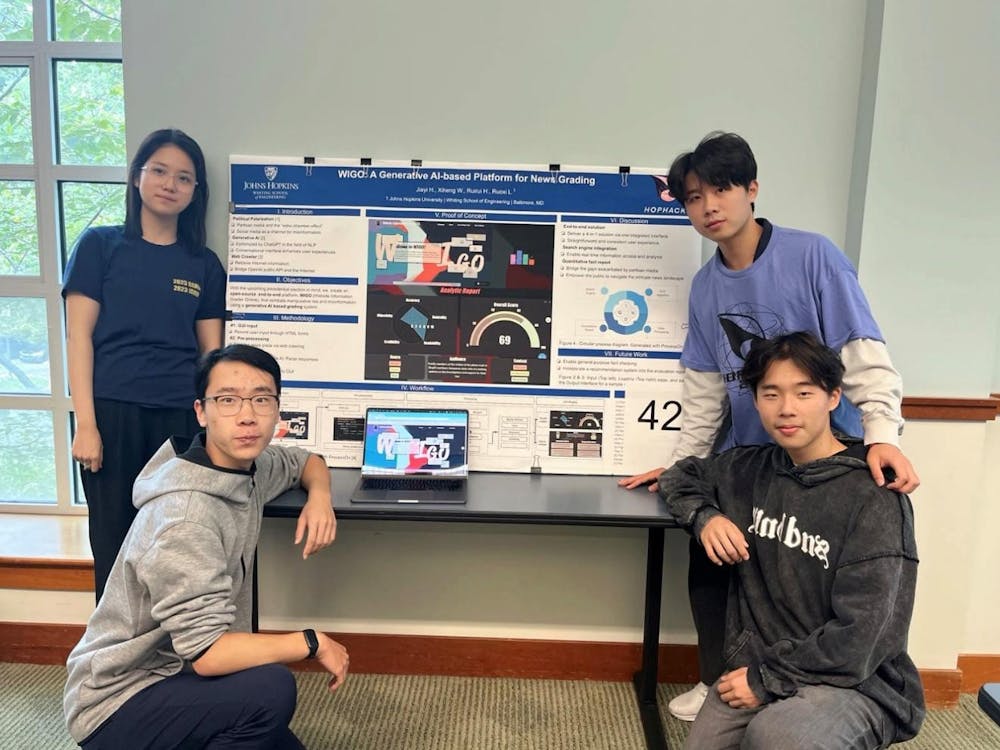 COURTESY OF ANNIE HUANG
Huang (top left) shares her experiences as a freshman participating in HopHacks, a 36-hour coding competition, alongside Tom Wang (bottom left), Jonathan He (top right) and Kevin Lie (bottom right).