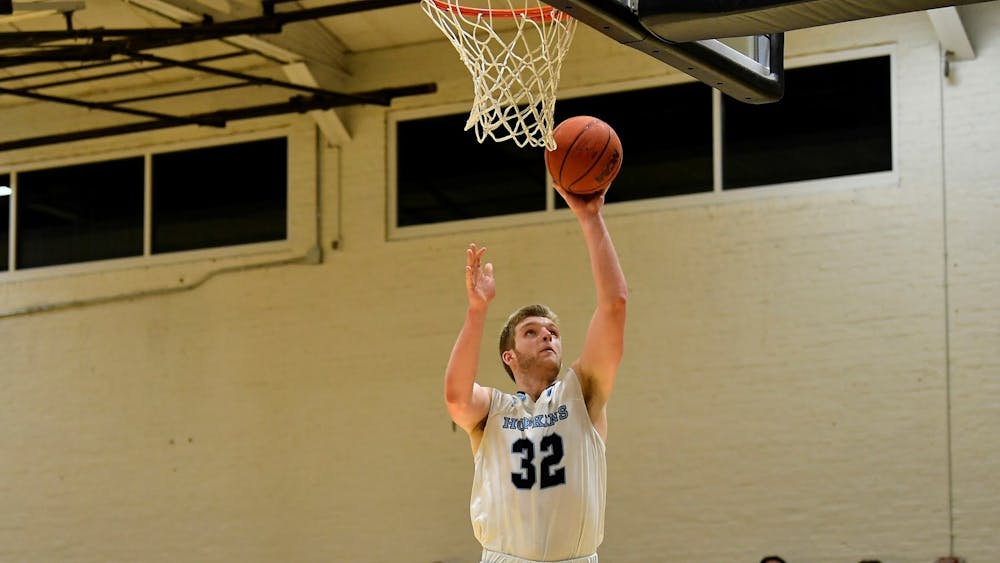 HOPKINSSPORTS.COM
M. basketball earned second place in the Centennial Conference this season.