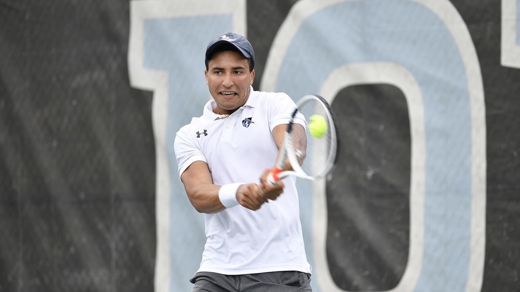 HOPKINSSPORTS.COM
Senior Aaron Carey’s win in singles play clinched the victory for Hopkins.