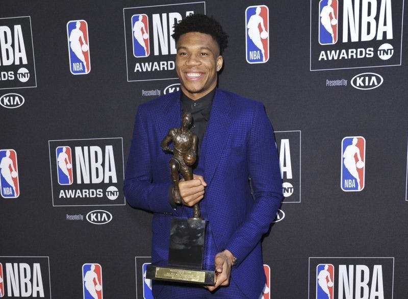 COURTESY OF RICHARD SHOTWELL
Milwaukee Bucks forward Giannis Antetokounmpo beams as he holds his 2018-19 MVP award.