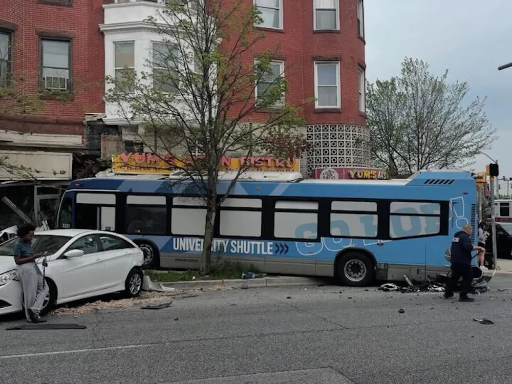 COURTESY OF MIKA YAMAMOTO
A collision on Saturday, April 19 led to the JHMI bus crashing into buildings and vehicles at 25th and North Charles Street. 