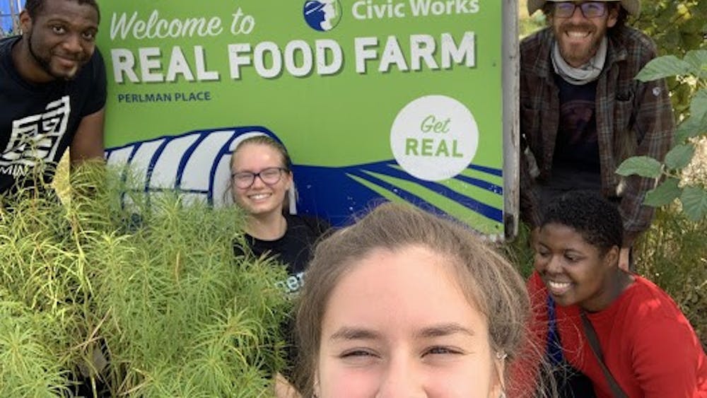 COURTESY OF LAÍS SANTORO
Santoro and members of Real Food Hopkins volunteer at Real Food Farm in Baltimore.