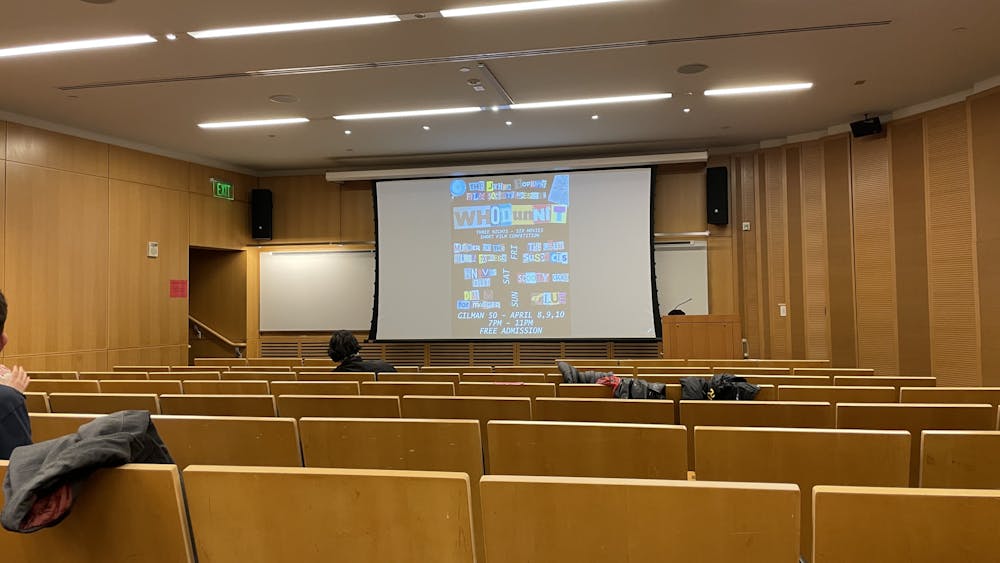 COURTESY OF SOPHIA PASALIS
The Hopkins Film Festival poster displays in a screening room of theater-goers.