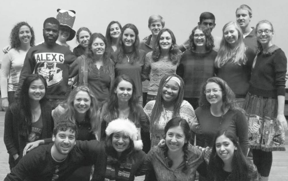 STAFF PHOTO
Last year’s News-Letter editors, numbering over twenty, pose for a staff photo at the holidays.  