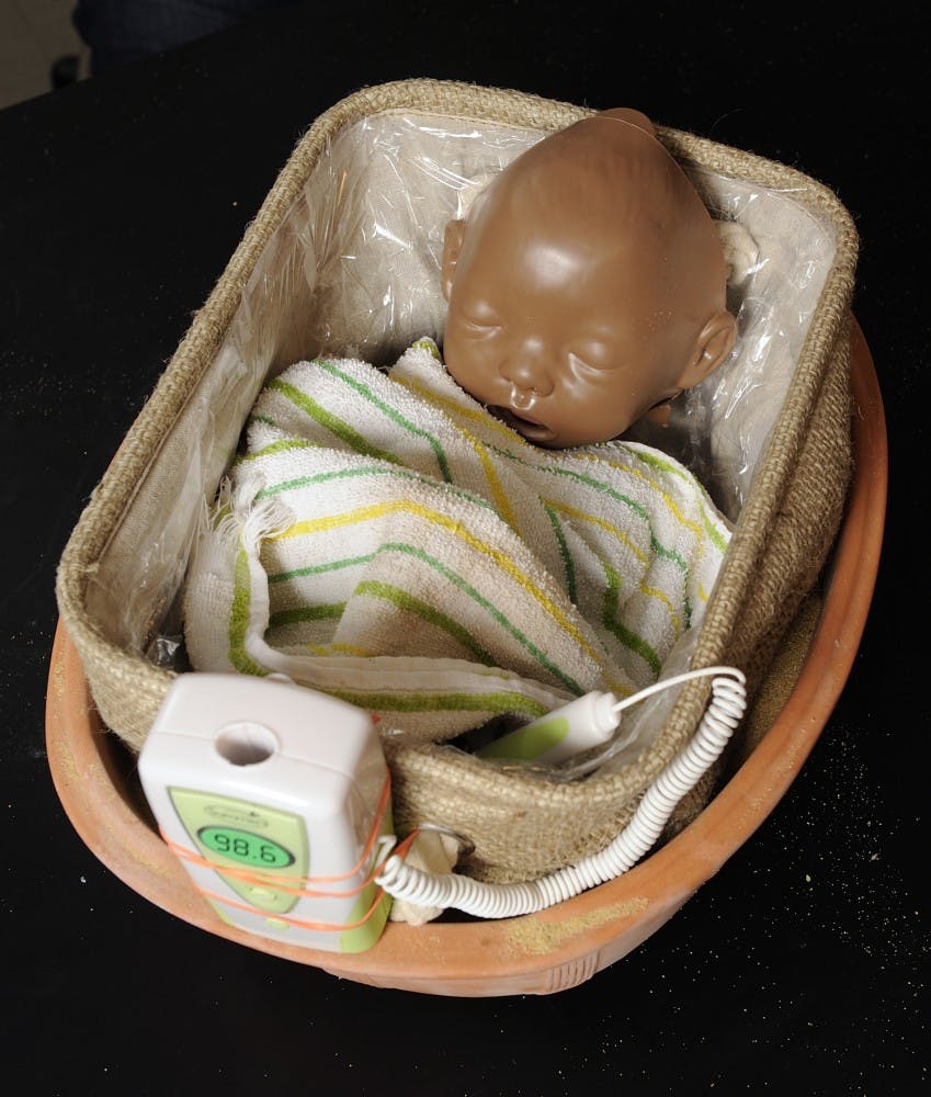 COURTESY OF PHIL SNEIDERMAN
The device uses sand and clay to lower the baby’s body temperature.