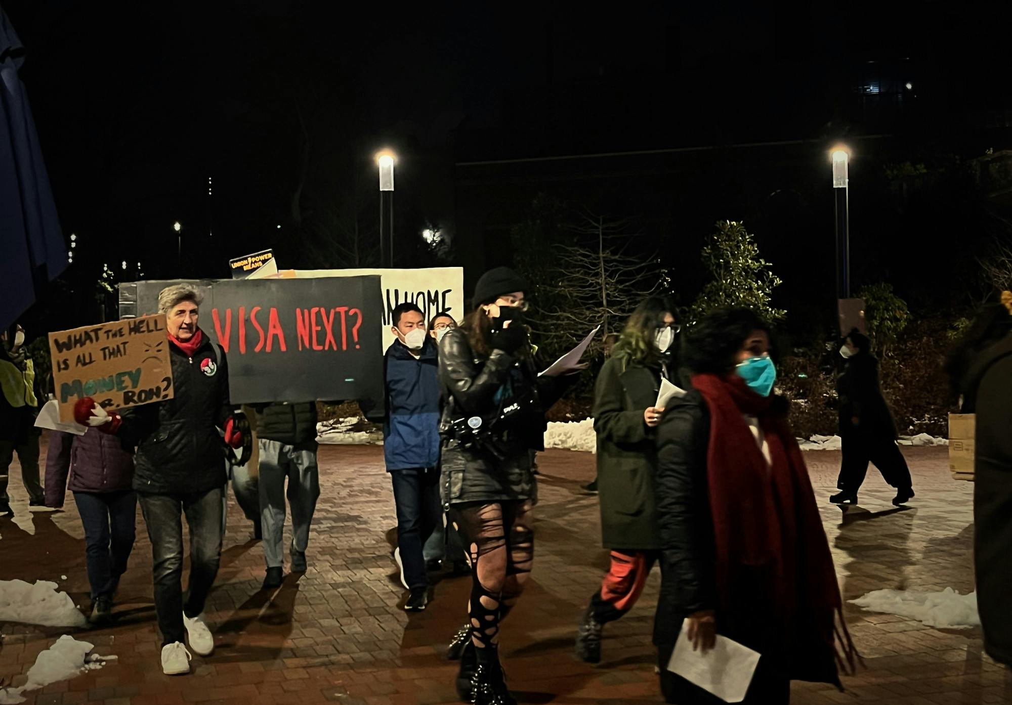 COURTESY OF NAOMI MAO
In a protest organized by TRU-UE, members of the Hopkins community urged the University to provide legal and financial aid to Ehsan Rajabi and his wife, who have been stuck in Canada since their visa cancelations.