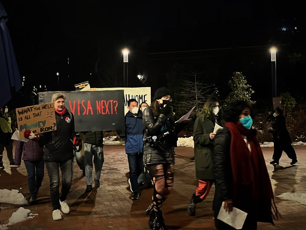 COURTESY OF NAOMI MAO
In a protest organized by TRU-UE, members of the Hopkins community urged the University to provide legal and financial aid to Ehsan Rajabi and his wife, who have been stuck in Canada since their visa cancelations.