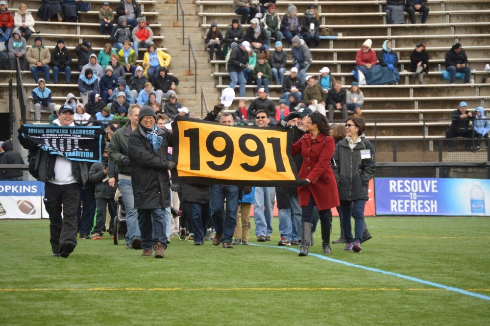 Ellie Hallenborg/PHOTOGRAPHY STAFF
Members of the Class of 1991 attended the Homecoming game.