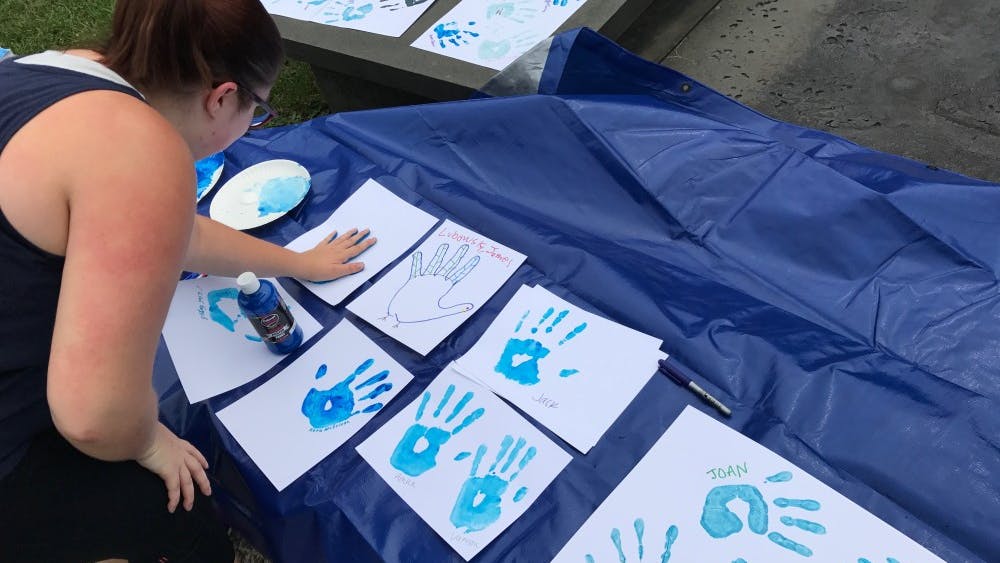 COURTESY OF JACOB TOOK
Students committed to stand against hazing by signing their handprints.