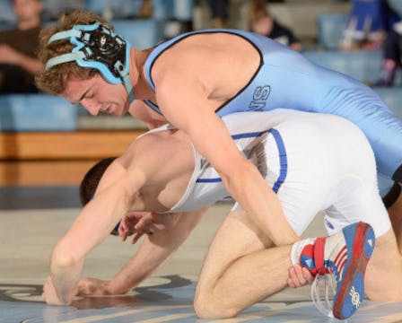 HOPKINSSPORTS.COM
Senior Evan Krumheuer performs a move against Saturday’s opponent.