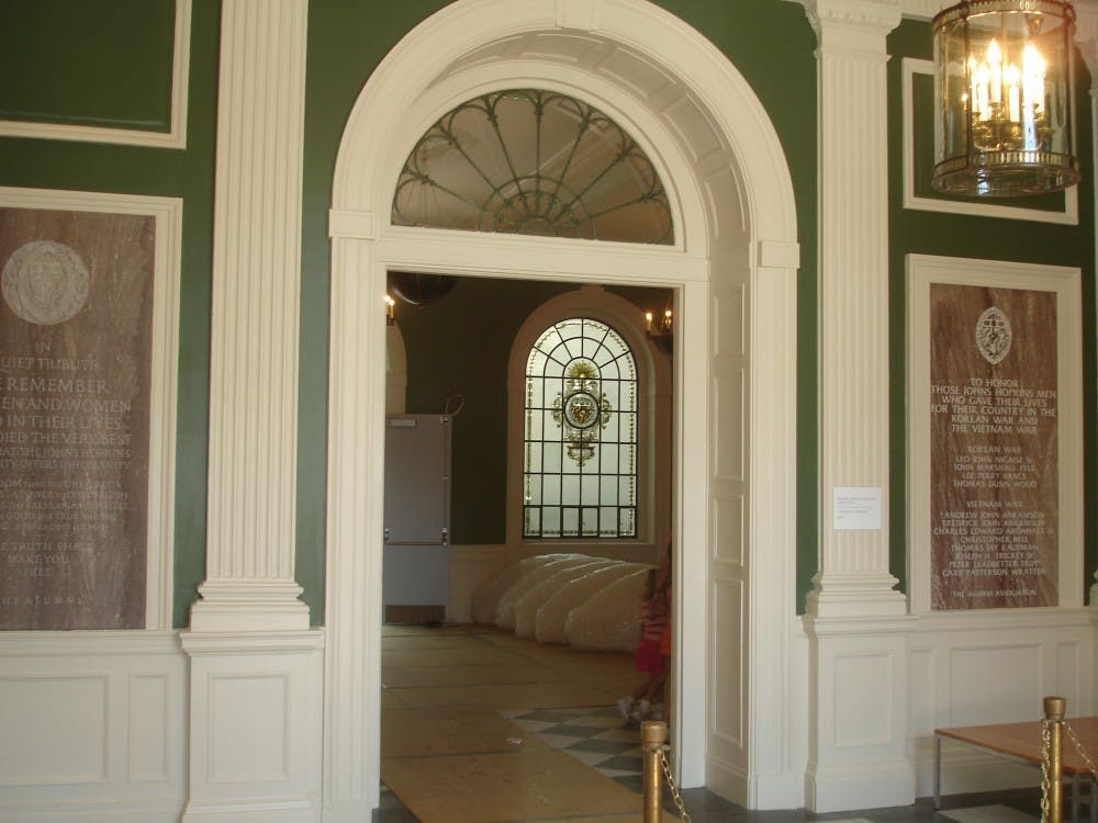 During the renovation process, parts of the building that had historical significance, such as these memorial markers, were covered for protection. Because of this, Gilman Hall maintains a link to its past in several places. 