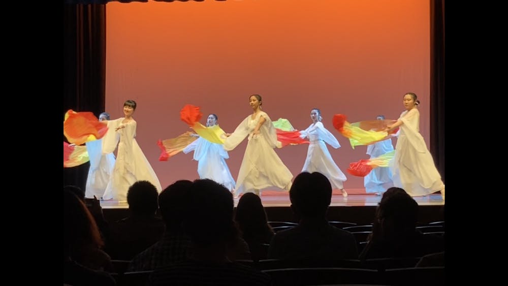 COURTESY OF HELENA GIFFORD
The Lan Yun Blue Orchids perform a fan dance during their Spring Showcase.