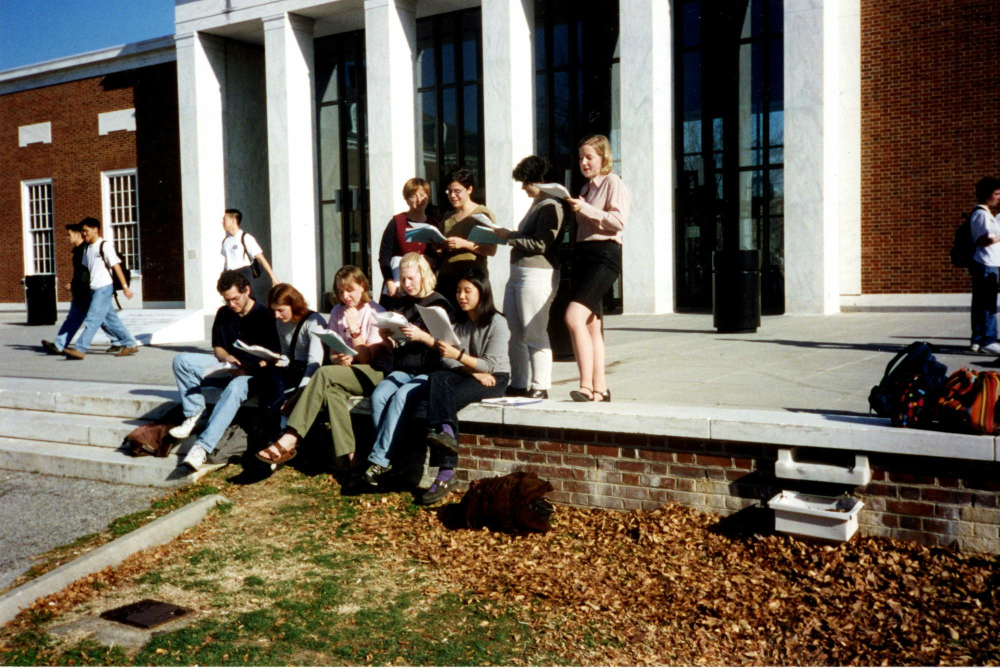 COURTESY OF THE UNIVERSITY ARCHIVES — SHERIDAN LIBRARIES&nbsp;
Members of the Student Labor Action Committee read in front of MSE Library circa 2000, around the time Valdez joined The News-Letter.