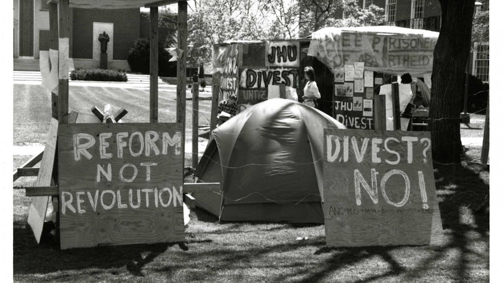 COURTESY OF JOHNS HOPKINS UNIVERSITY SHERIDAN LIBRARIES
Students erected shanties on Wyman Quad in protest against apartheid in South Africa.