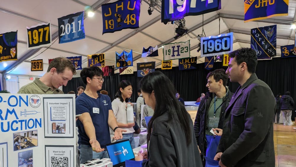 COURTESY OF WILL KIRK
HHR discusses its mission at this year’s alumni weekend major fest.