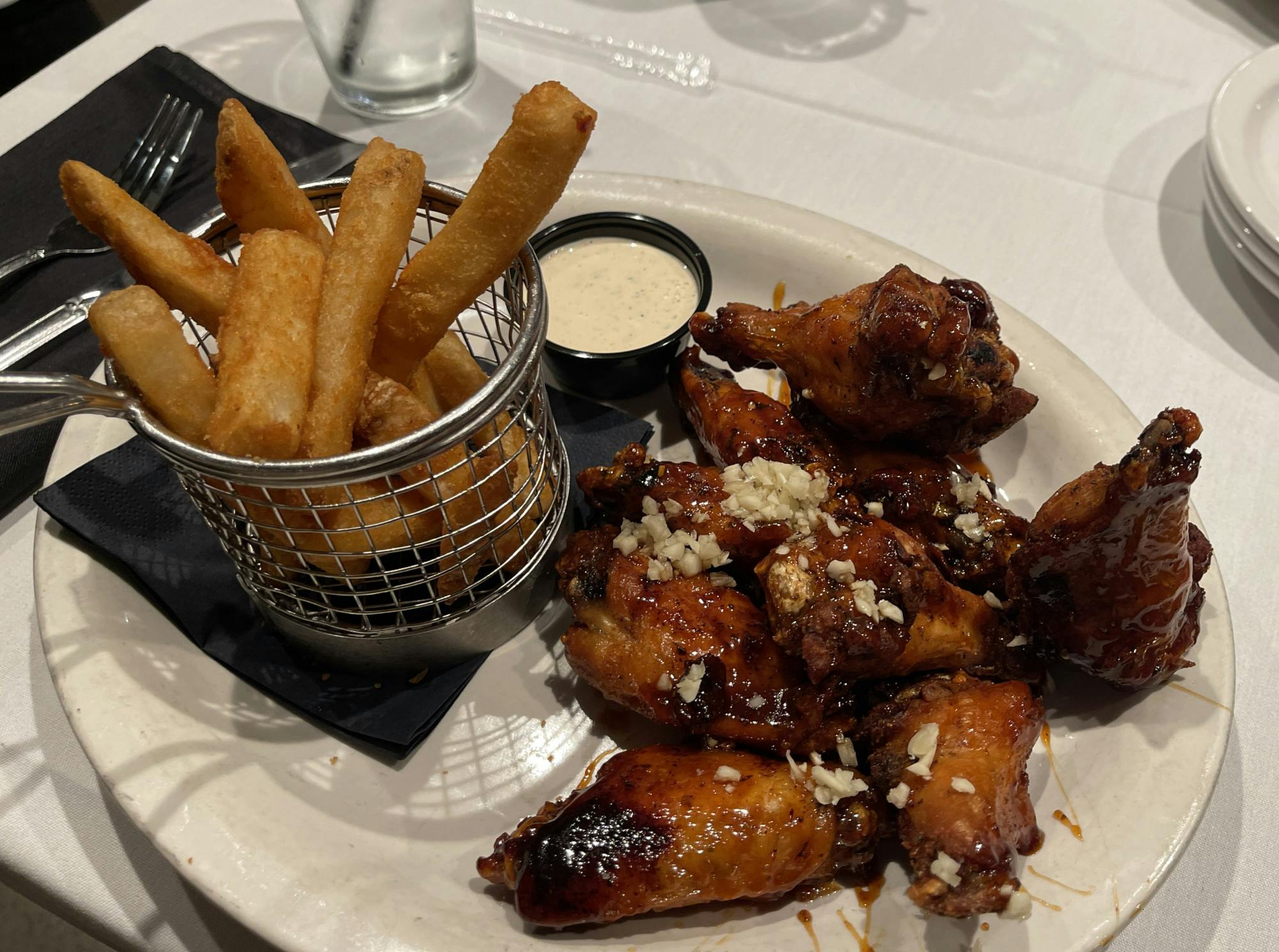 COURTESY OF DHARANI MOORTHY
Wings from Papi Cuisine served with fries and old bay ranch.