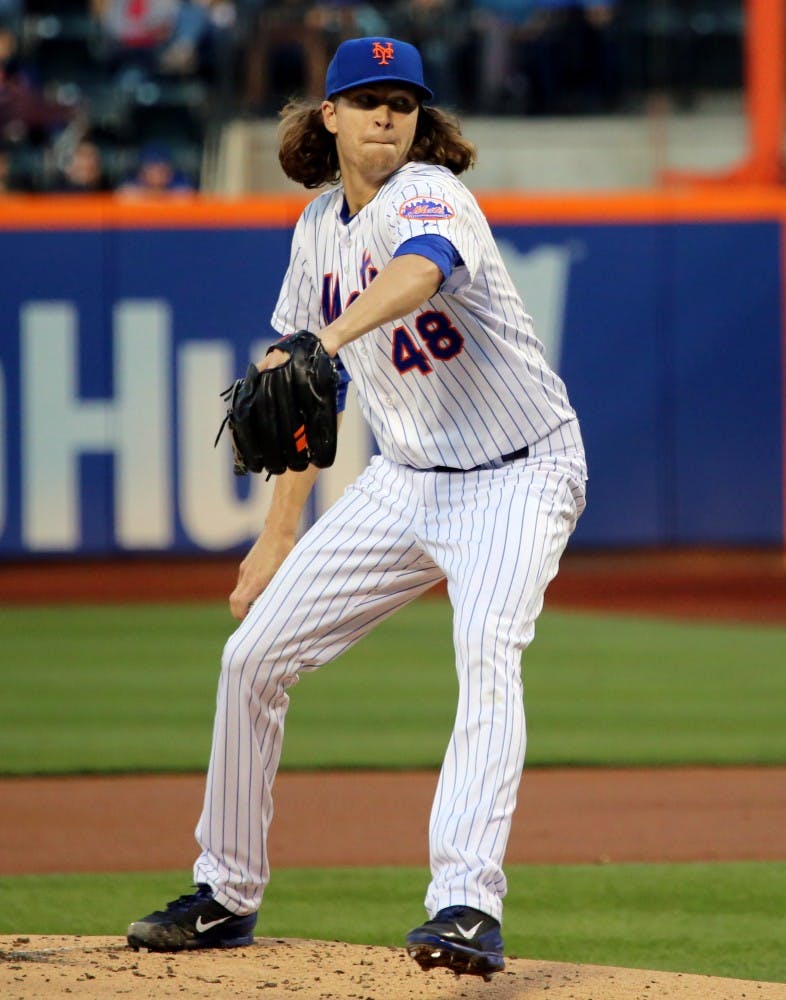 Jacob deGrom delivers a pitch against the Orioles.