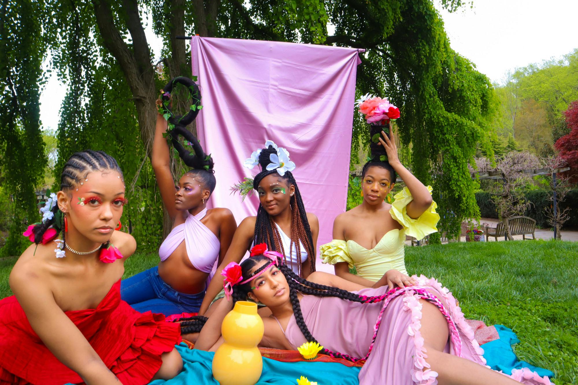 COURTESY OF MO.NA. GEMS.
Models show off the colorful and sustainable designs of Mo.Na Gems.