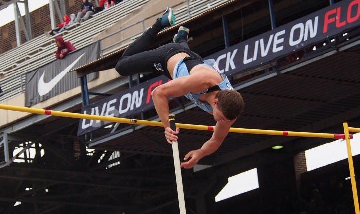 HOPKINSSPORTS.COM
Senior Andrew Bartnett jumps 4.80 m to win the pole vault at the Diplomat Open.