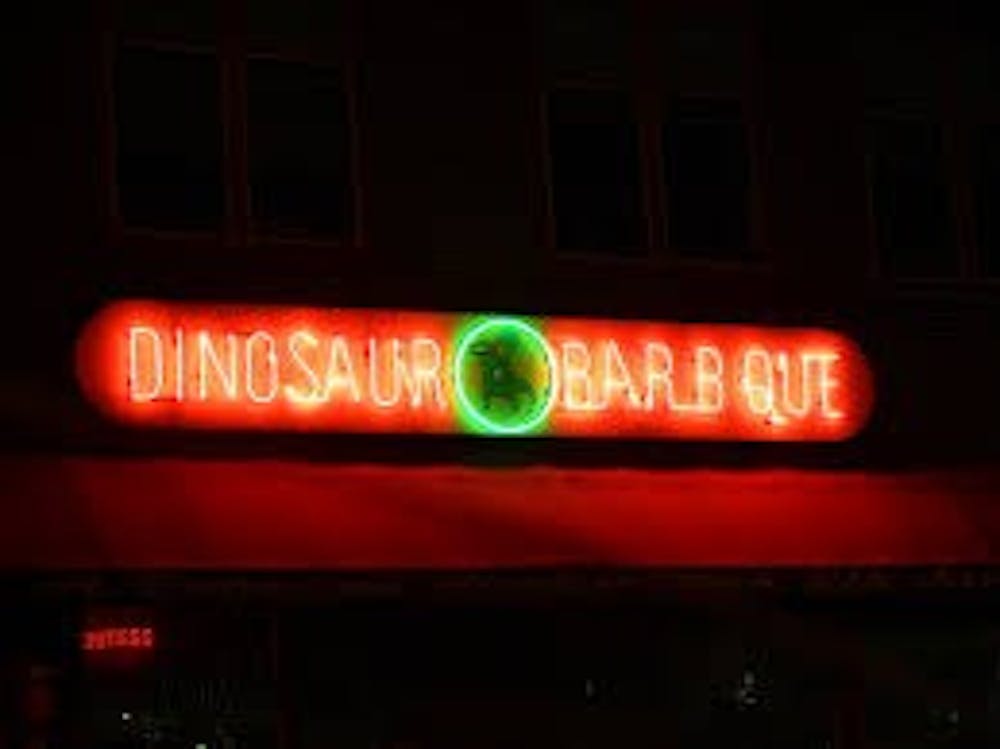 JOSE VALCARCEL VIA FLICKR CC-BY-NC-SA-2.0
Each restaurant in the Dinosaur BBQ chain, which originated in Syracuse, bears  this logo above its doors.