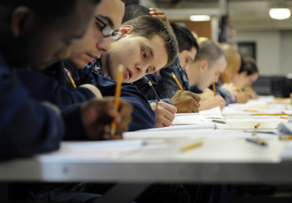 110310-N-6505H-049ARABIAN SEA (March 10, 2011) Operations Specialist 3rd Class Patrick L. Palkowski participates in the E-5 advancement exam on the aft mess decks aboard the Nimitz-class aircraft carrier USS Carl Vinson (CVN 70). The Carl Vinson Carrier Strike Group is deployed supporting maritime security operations and theater security cooperation efforts in the U.S. 5th Fleet area of responsibility. (U.S. Navy photo by Mass Communication Specialist Seaman Timothy A. Hazel/Released)
