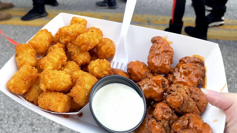 COURTESY OF GRETA MARAS
Maras reviews the Baltimore Street Food Festival's many offerings, including the boneless buffalo wings and tater tots from Two Smooth Dudes.
