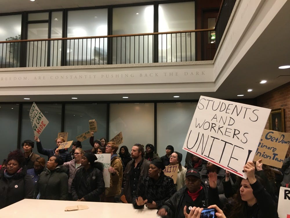 COURTESY OF SAM FOSSUM
Protesters told Daniels “You can’t hide! We can see your greedy side.”