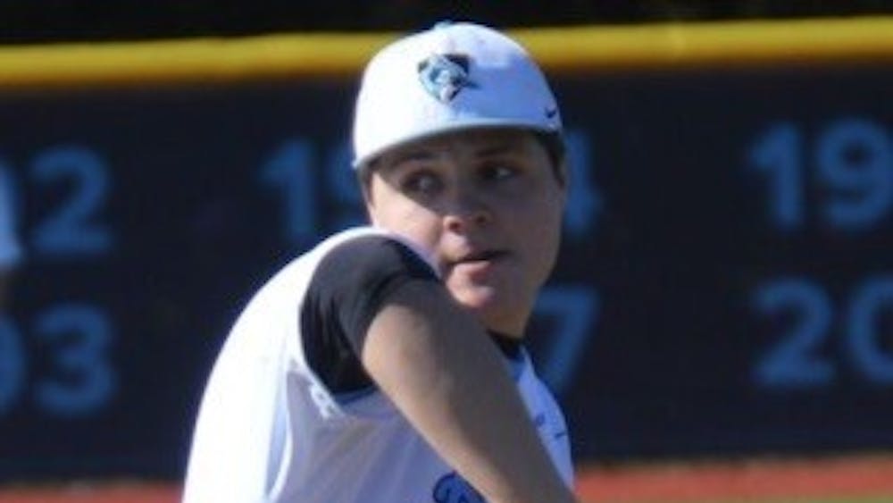 ELLIE HALLENBORG/PHOTOGRAPHY STAFF
Sophomore Nick Burns rears back and fires vs. New Paltz on Sunday.