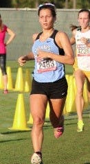HOPKINSSPORTS.COM
Senior Sophia Meehan cruised to her second-straight regional win.