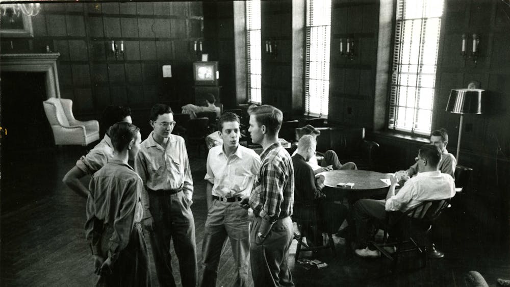 COURTESY OF THE UNIVERSITY ARCHIVES — SHERIDAN LIBRARIES&nbsp;
Students discuss among themselves in AMR I circa the 1950s, around the time Baensch wrote for The News-Letter.